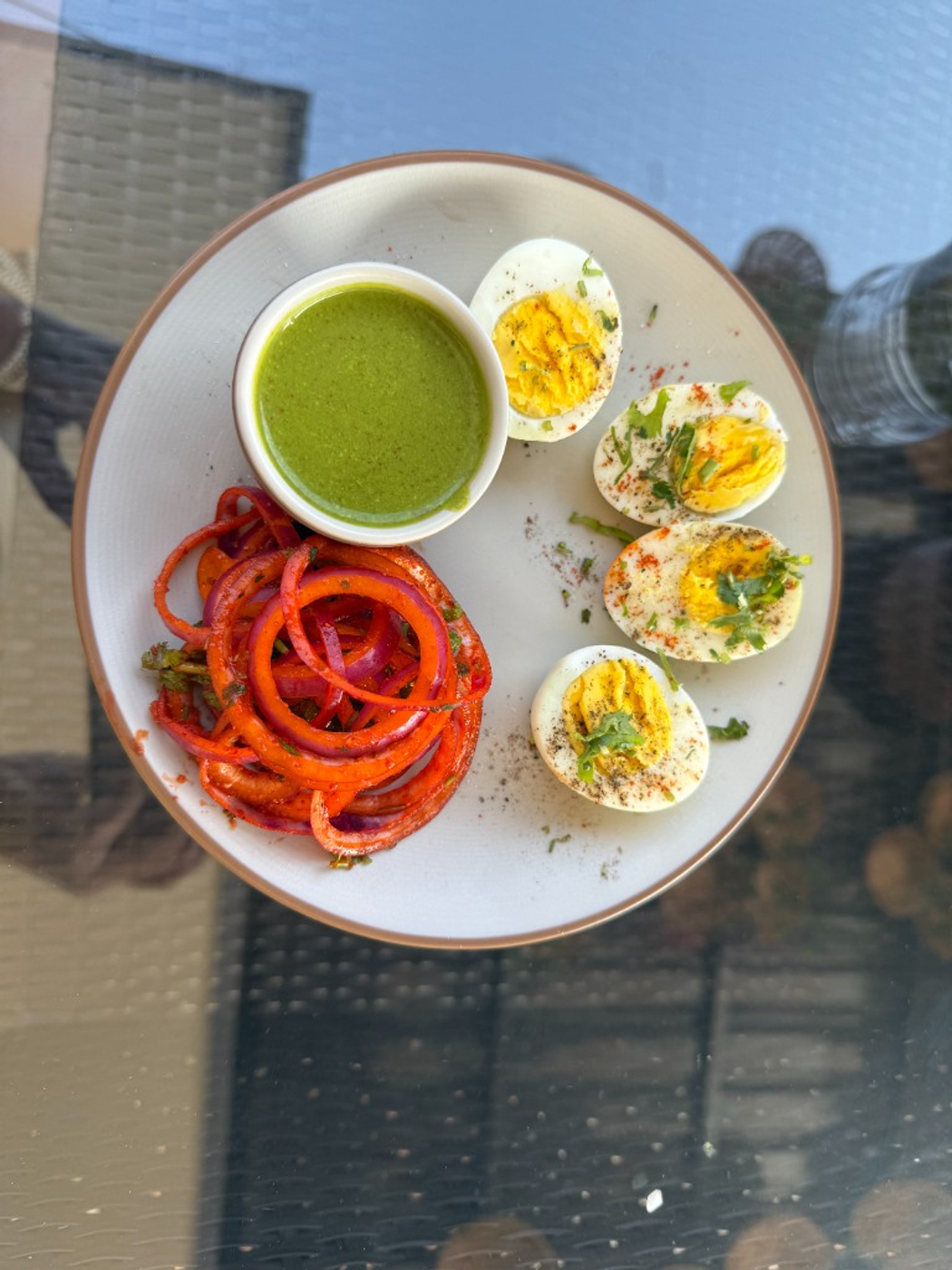 Boiled eggs with chutney and masala onions