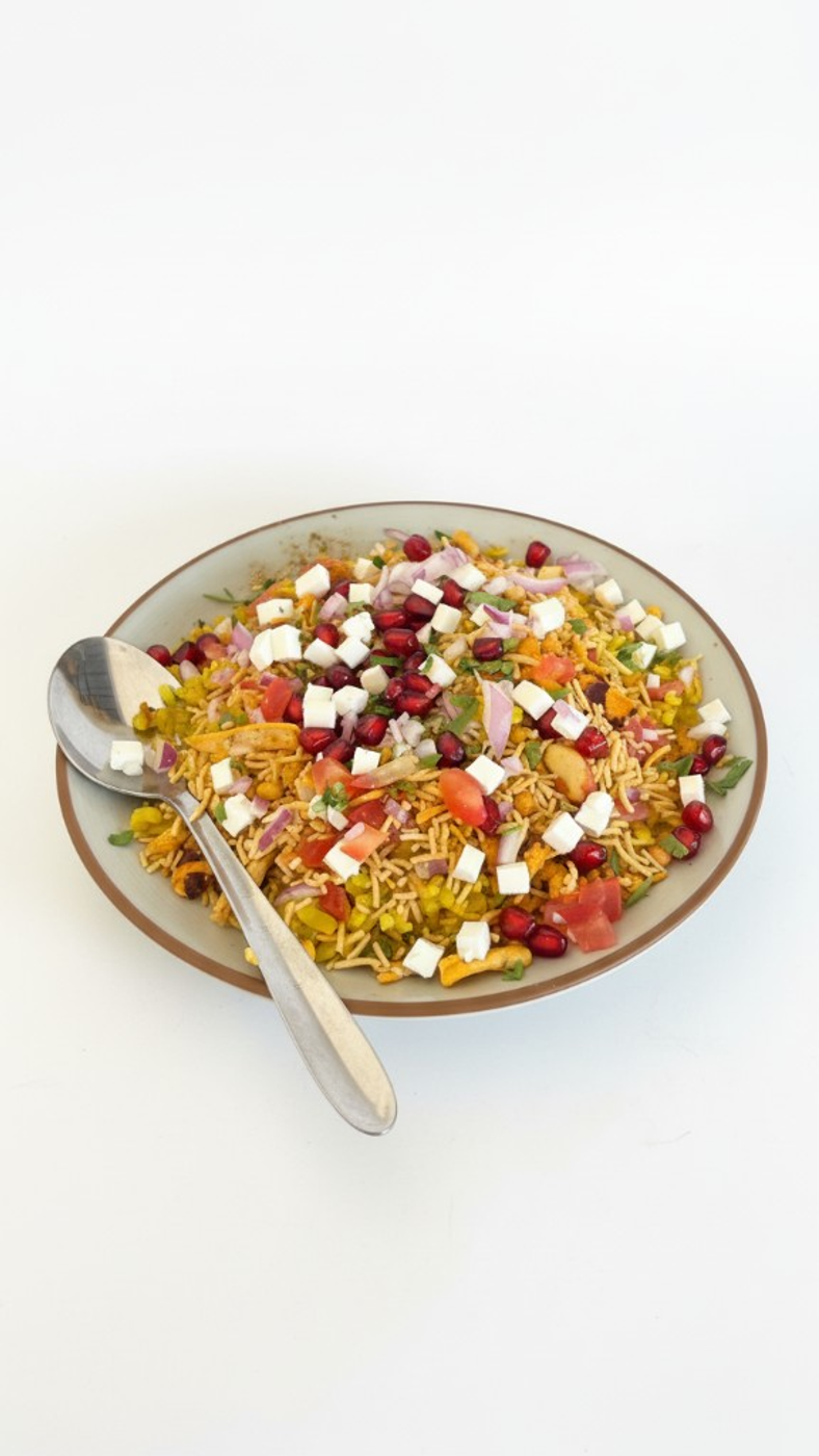 Vegetable poha with pomegranate and sev